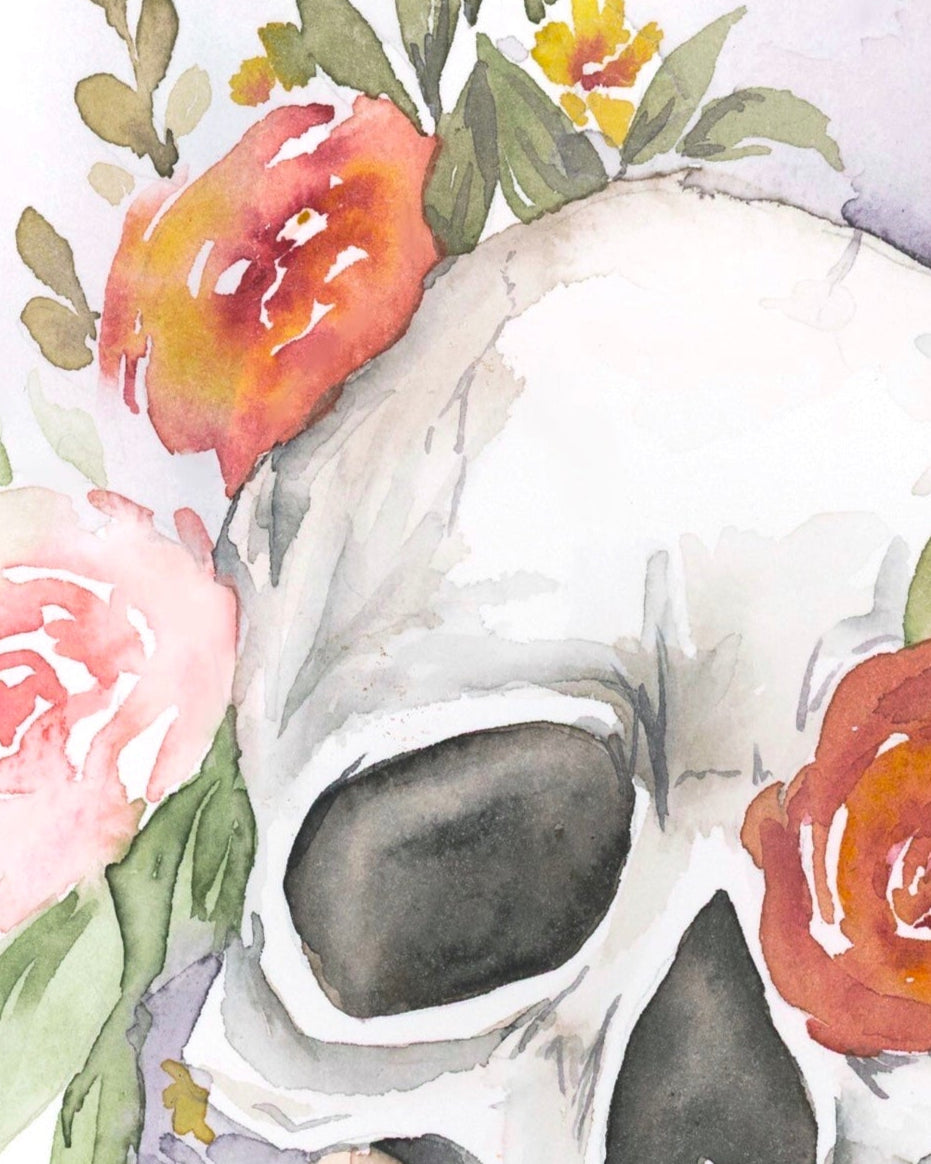 Skull with floral decorations on a white background